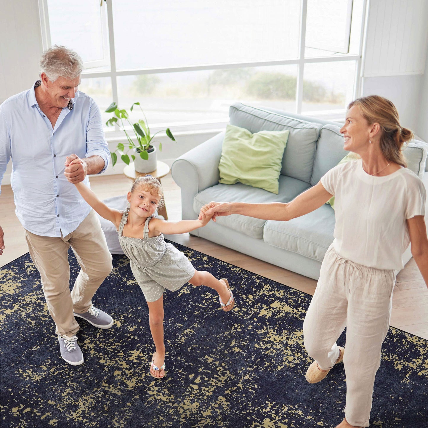 Maval - 5' X 8' Washable Area Rug - Black / Gold
