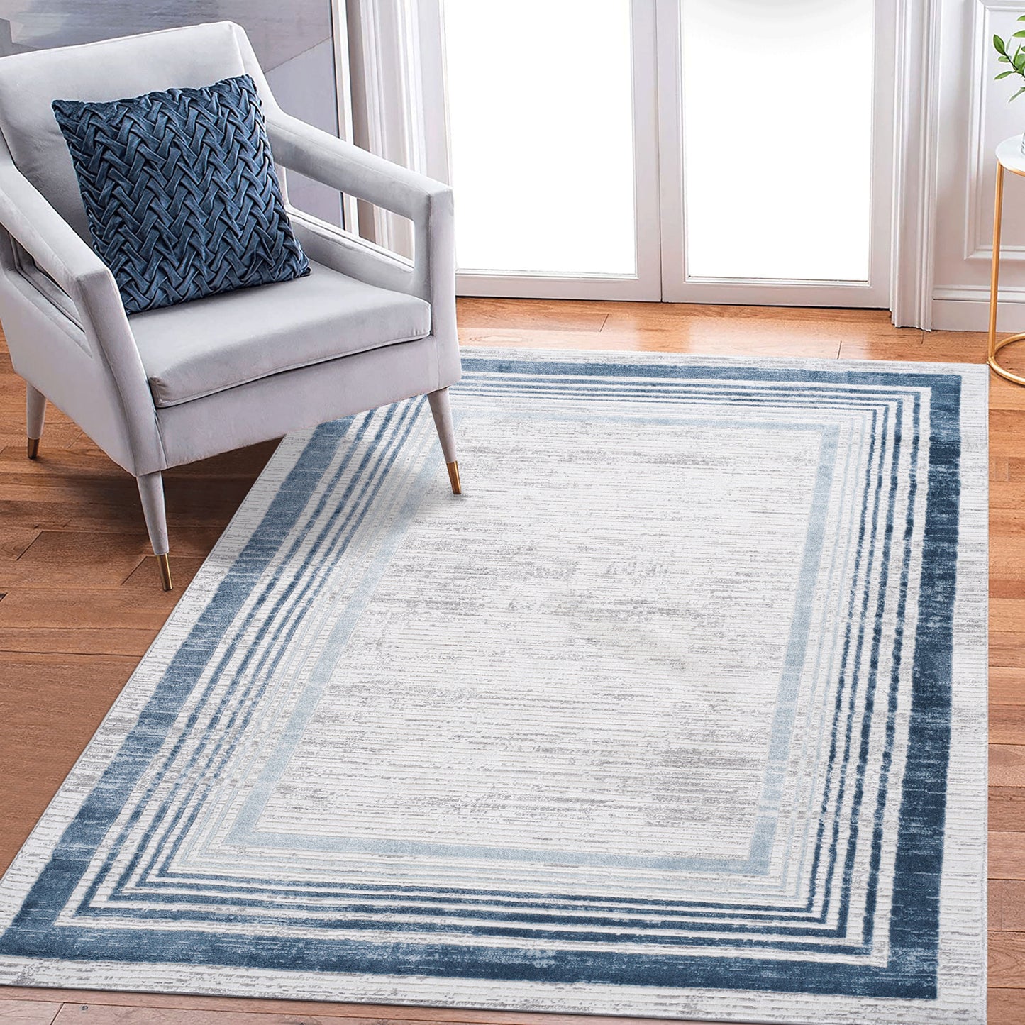 Marfi - 5' X 7' Bordered Area Rug - Blue / Ivory